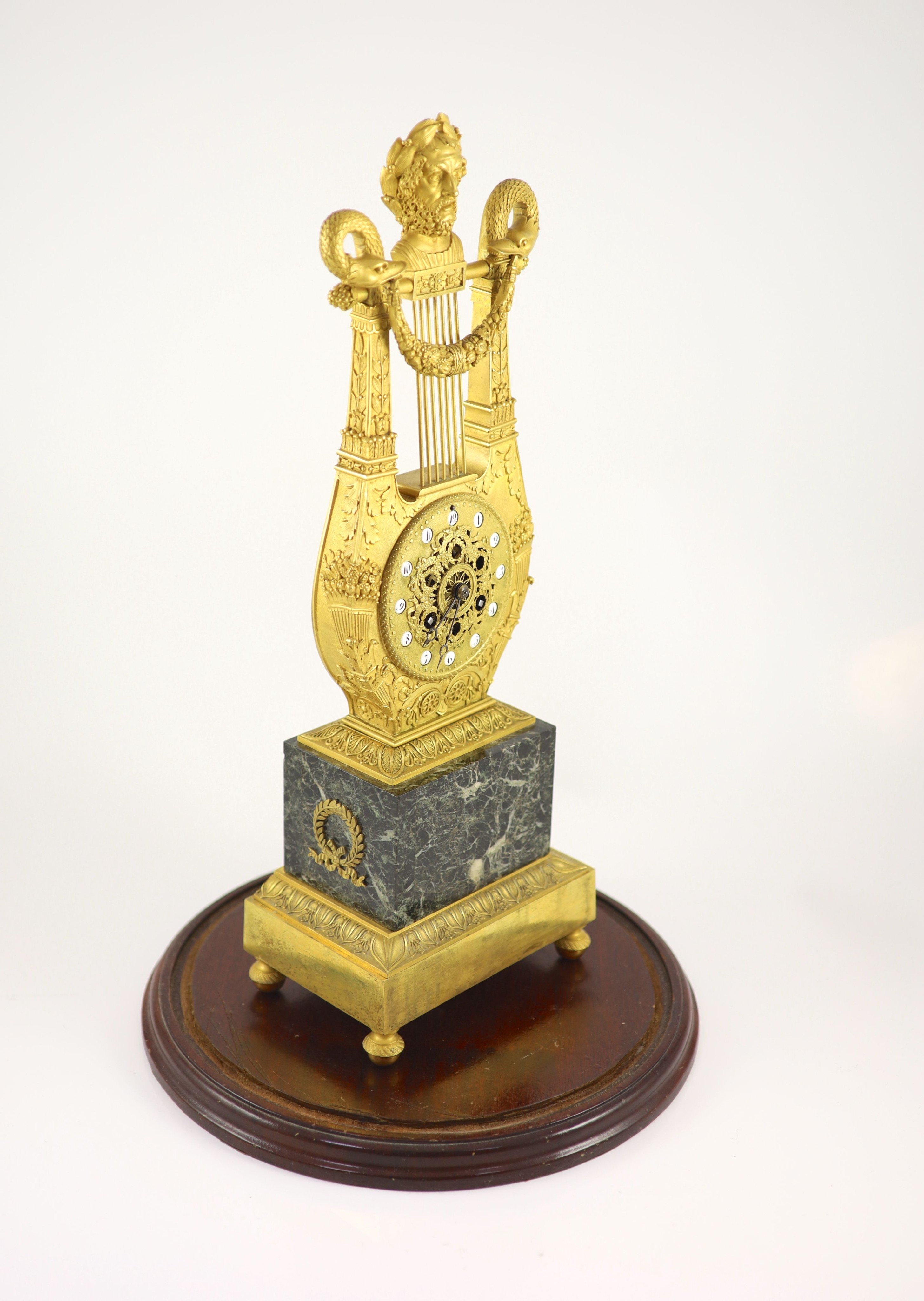 A 19th-century French ormolu and marble lyre shaped mantel clock H 52cm. W 18cm. D 12cm.